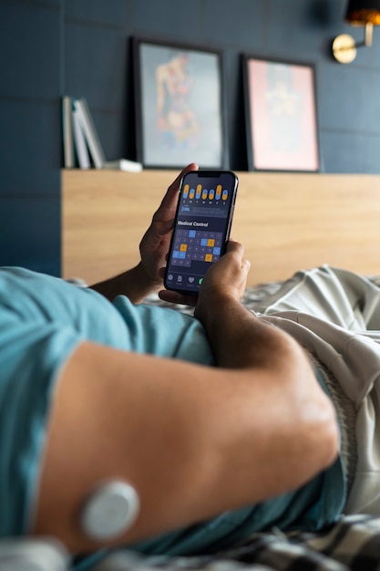 A smartphone displaying a health app with data synchronized from a wearable. Charts and graphs show activity levels, sleep patterns, and heart rate data