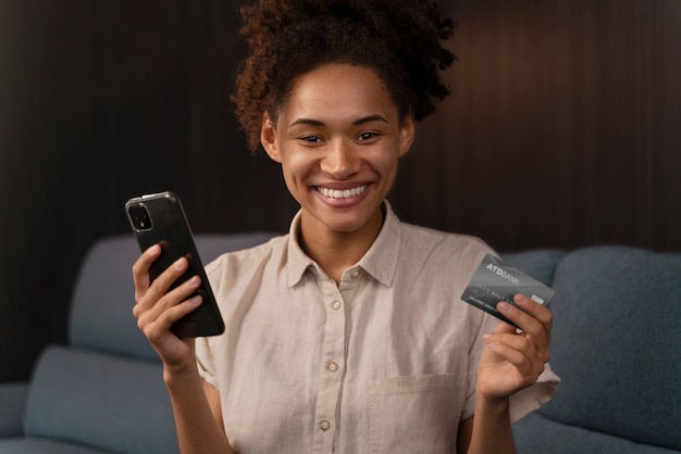 A customer smiling while interacting with a banking app on their smartphone, showcasing ease of use and AI-driven personalization.