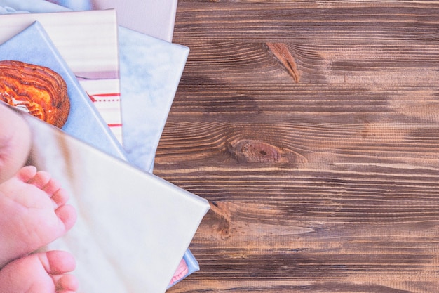 Close-up of various documents such as birth certificates, bank statements, and ID cards arranged on a table, symbolizing the required paperwork for the childcare voucher application.