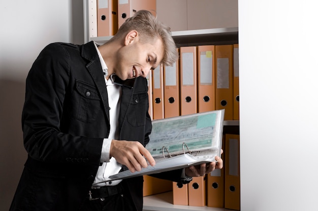 A person looking stressed and overwhelmed while reviewing legal documents, representing the challenges of navigating the unemployment benefits process.