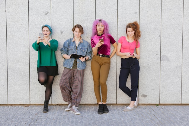 A collage of images showing various aspects of K-Pop fandom in Spain.  Include fans wearing K-Pop merchandise, attending dance classes to learn K-Pop choreographies, creating fan art, and participating in online discussions.