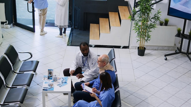 A group of Spanish and Japanese businesspeople in a board meeting, discussing strategies for healthcare solutions. The setting is a modern office with a mix of cultural elements.