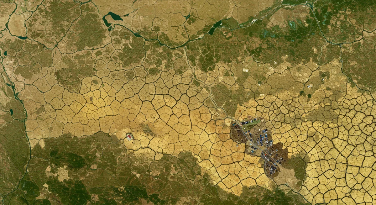 Arid landscape illustrating climate-induced humanitarian challenges and displacement.